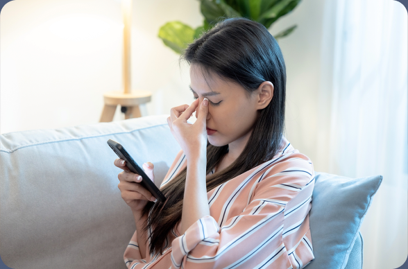 Patient looking frustrated while trying to use the old booking mini-program on her phone